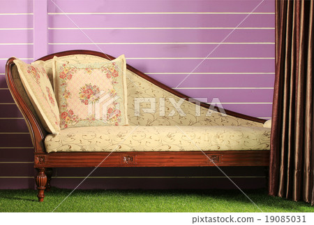 Opened curtain and vintage sofa 19085031