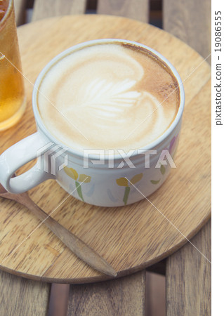 Cup of latte coffee with cold tea on wooden tray 19086555