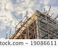 The Building contruction with a Wooden scaffold 19086611