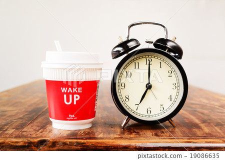 Alarm clock and coffee cup, Seven o'clock Alarm clock and coffee cup, Seven o'clock 19086635