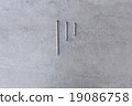 nails isolated on tile 19086758