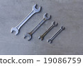 Four wrenches on tile texture 19086759