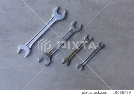 Four wrenches on tile texture Four wrenches on tile texture 19086759