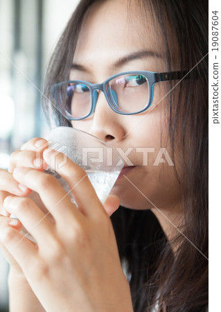 Asia woman drink water. 19087604