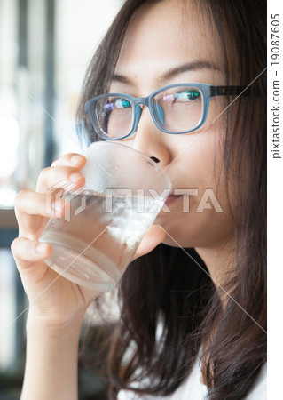 Asia woman drink water. 19087605
