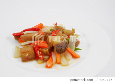 The Thai stir fried crispy pork in the white plate 19089747