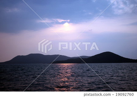 Ocean with island and Sunset. Ocean with island and Sunset. 19092760