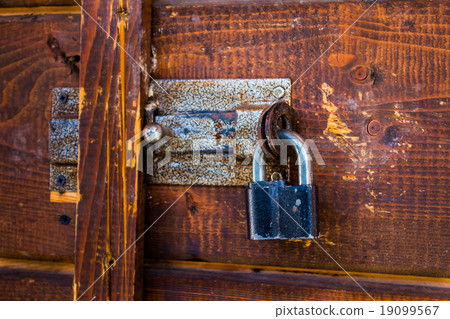 Closed iron lock on the door 19099567