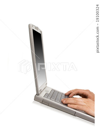 Businessman typing on a notebook Businessman typing on a notebook 19100324