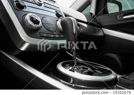 Modern car interior, gearstick close up photo Modern car interior, gearstick close up photo 19102679