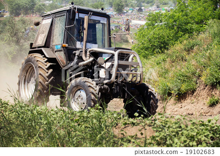 Farm tractor goes on road 19102683