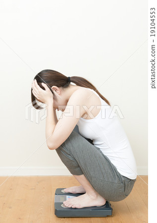 A woman riding a health meter 19104553