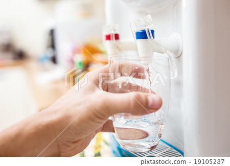 Man getting a cold, refreshing drink Man getting a cold, refreshing drink 19105287