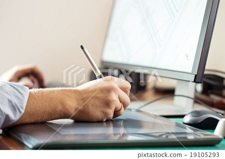 Graphic designer using digital tablet and computer 19105293