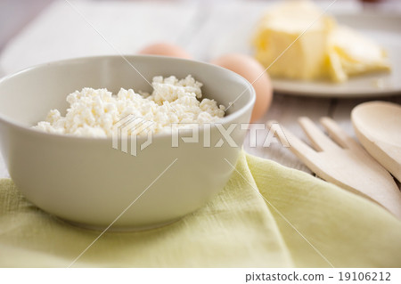 Fresh dairy products and eggs on rustic wood 19106212