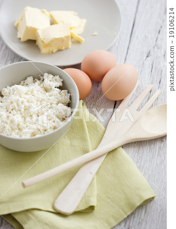 Fresh dairy products and eggs on rustic wood 19106214