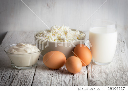 Fresh dairy products and eggs on rustic wood 19106217