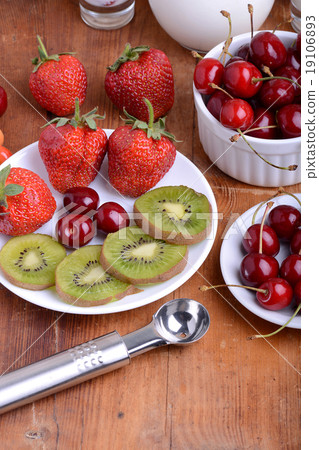 fruit with cherry, strawberry, kiwi on wooden fruit with cherry, strawberry, kiwi on wooden 19106893