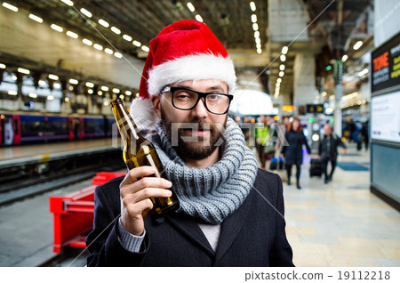 Young man with beer bottle Young man with beer bottle 19112218