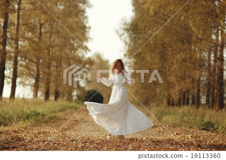 portrait of a beautiful girl in a dress at sunset portrait of a beautiful girl in a dress at sunset 19113360