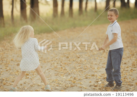 Brother and sister Autumn road 19113496