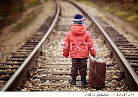 little traveler with a suitcase on the railroad little traveler with a suitcase on the railroad 19114177