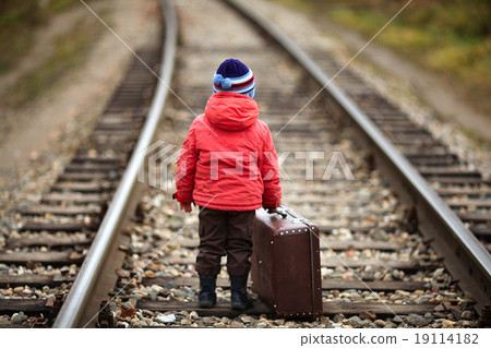 little traveler with a suitcase on the railroad little traveler with a suitcase on the railroad 19114182