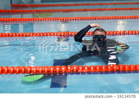 man teaches diving in the pool, swim coach man teaches diving in the pool, swim coach 19114570