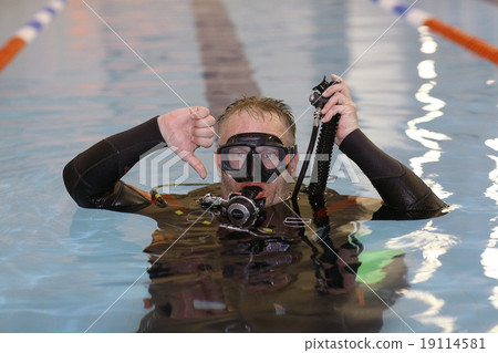 man teaches diving in the pool, swim coach man teaches diving in the pool, swim coach 19114581