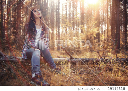 Beautiful girl in the forest landscape with sun rays 19114816