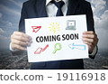 businessman show coming soon text on paper 19116918