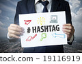 businessman show hashtag text on paper 19116919