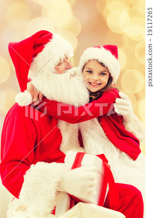 smiling little girl with santa claus smiling little girl with santa claus 19117265