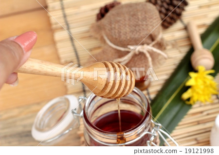 Honey variety with honeycomb and honey in a jar with beeswax. 19121998