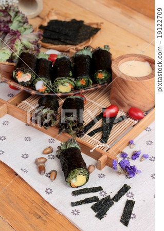 Vegetable salad wrapped with seaweed into spring rolls. Vegetable salad wrapped with seaweed into spring rolls. 19122709
