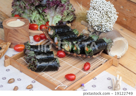 Vegetable salad wrapped with seaweed into spring rolls. Vegetable salad wrapped with seaweed into spring rolls. 19122749