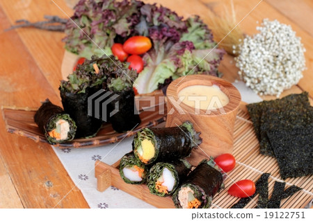 Vegetable salad wrapped with seaweed into spring rolls. Vegetable salad wrapped with seaweed into spring rolls. 19122751