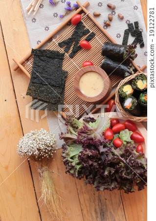 Vegetable salad wrapped with seaweed into spring rolls. 19122781