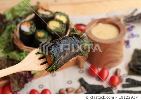 Vegetable salad wrapped with seaweed into spring rolls. 19122917