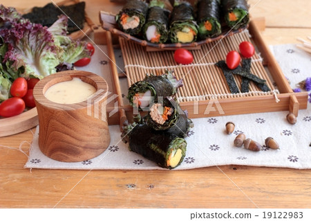 Vegetable salad wrapped with seaweed into spring rolls. Vegetable salad wrapped with seaweed into spring rolls. 19122983