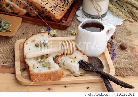 Brown bread with whole grain cereals of sliced and milk. Brown bread with whole grain cereals of sliced and milk. 19123261