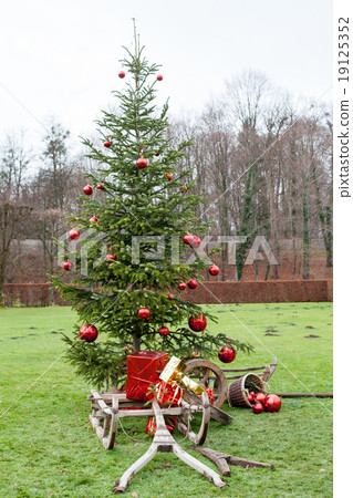 Old wooden frame a sledge with Christmas parcels b 19125352