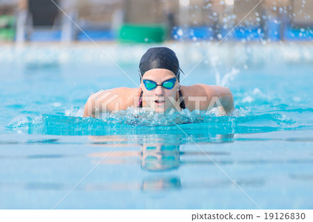 Young girl swimming butterfly stroke style Young girl swimming butterfly stroke style 19126830