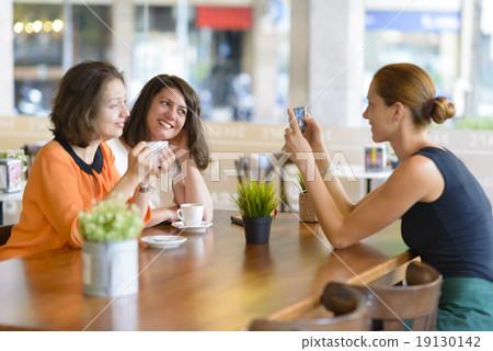 Women Having Fun in Restaurant 19130142