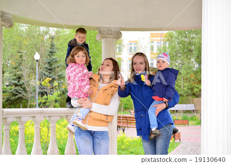 Two mothers with children on the walk in  gazebo 19130640