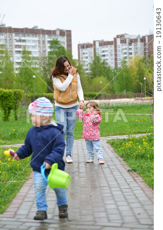 Mother And Daughter Walking Along Path Mother And Daughter Walking Along Path 19130643