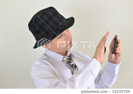 Boy teenager turns away from cell phone Boy teenager turns away from cell phone 19130794