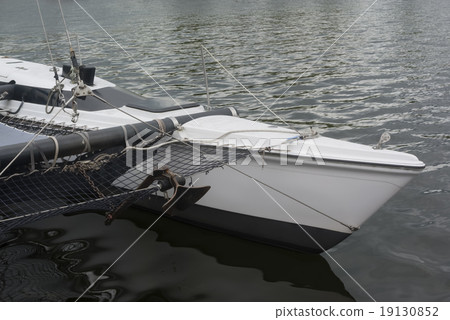 sailboat on a black lake on the quayside 19130852