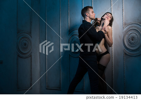 Two lovers under the wall of a beautiful interior 19134413