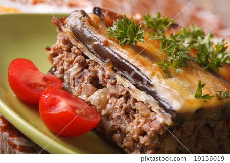 Serving traditional Greek moussaka on the plate Serving traditional Greek moussaka on the plate 19136019